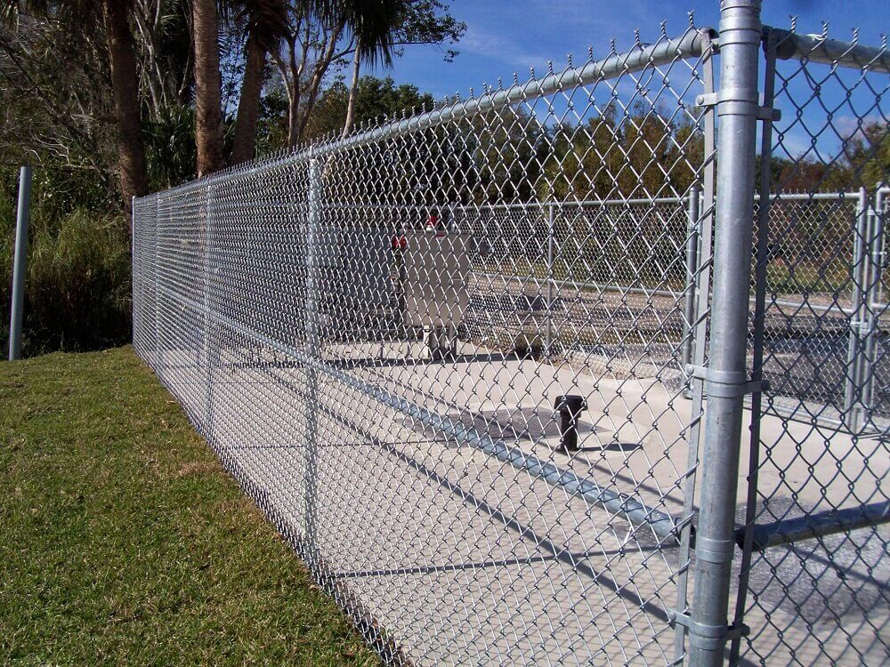 What measures should be taken when chain link fence is sprayed