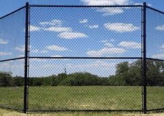 Application of plastic sprayed chain link fence