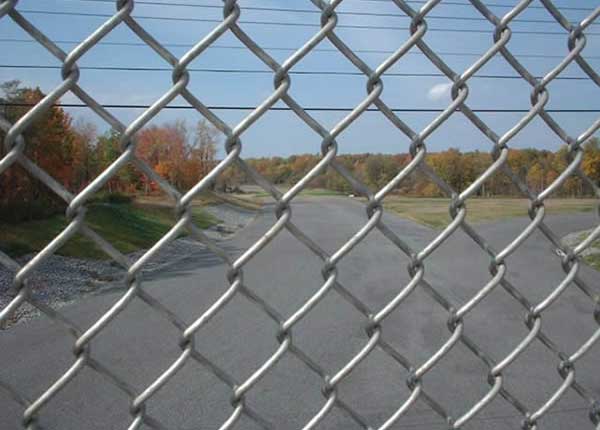 Chain link fence implements remedial measures for wall cracks