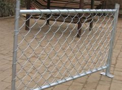 Chain link fence outlines the unique style of the building